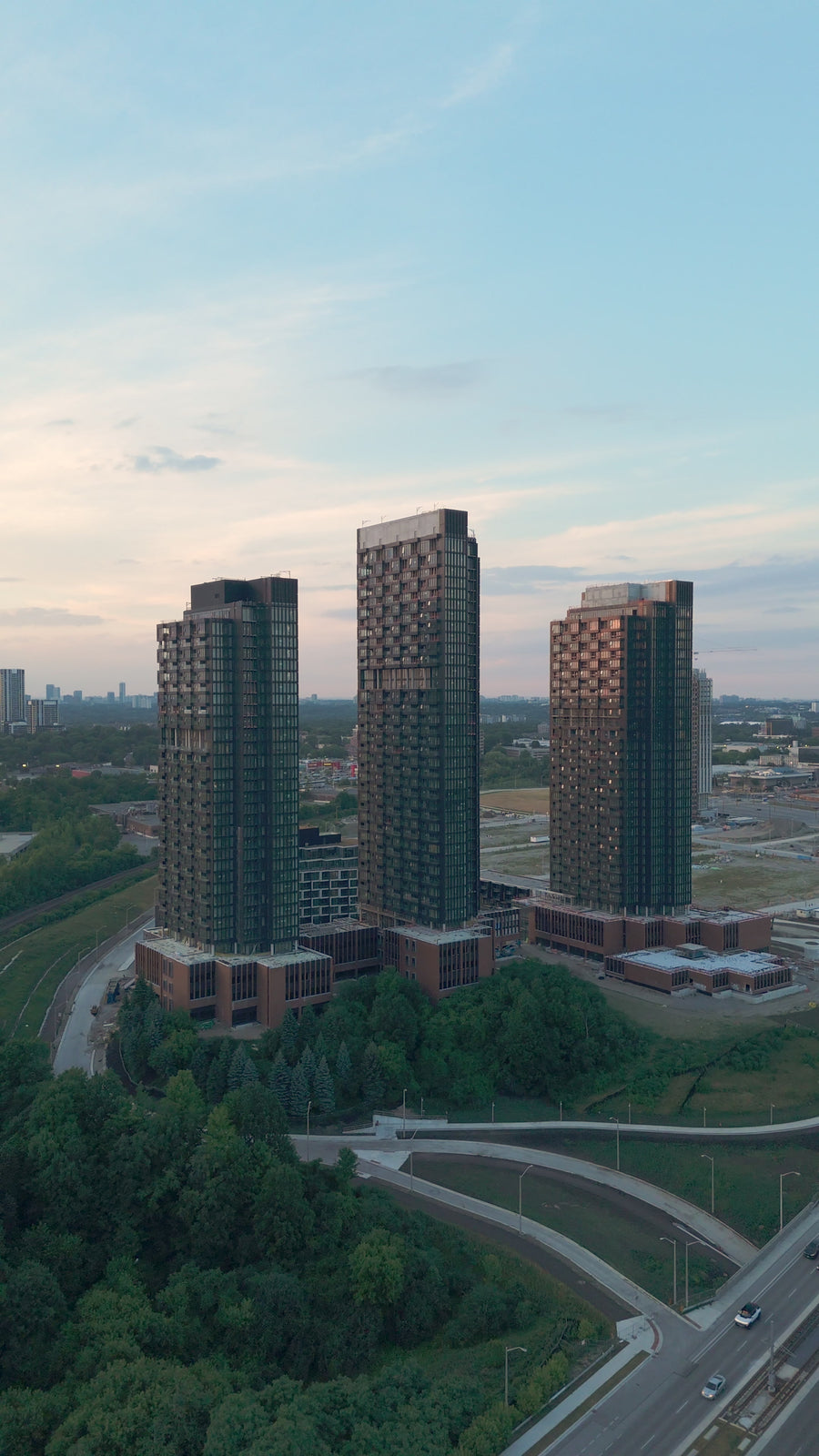 Residential Towers Highway Sunset Glow - Aerial Pan