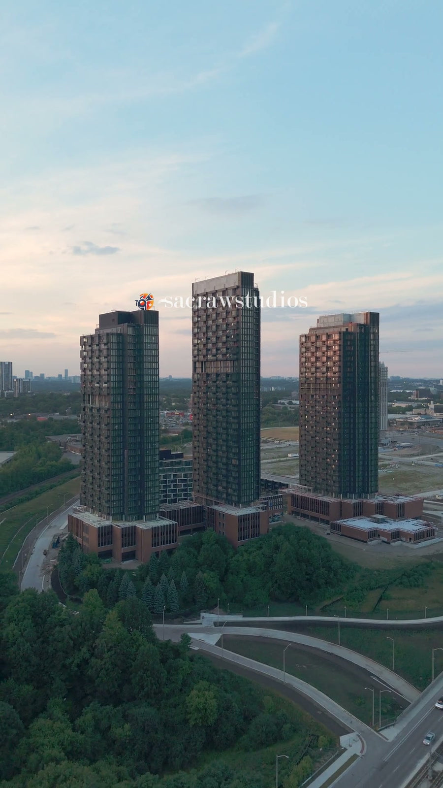 Residential Towers Highway Sunset Glow - Aerial Pan