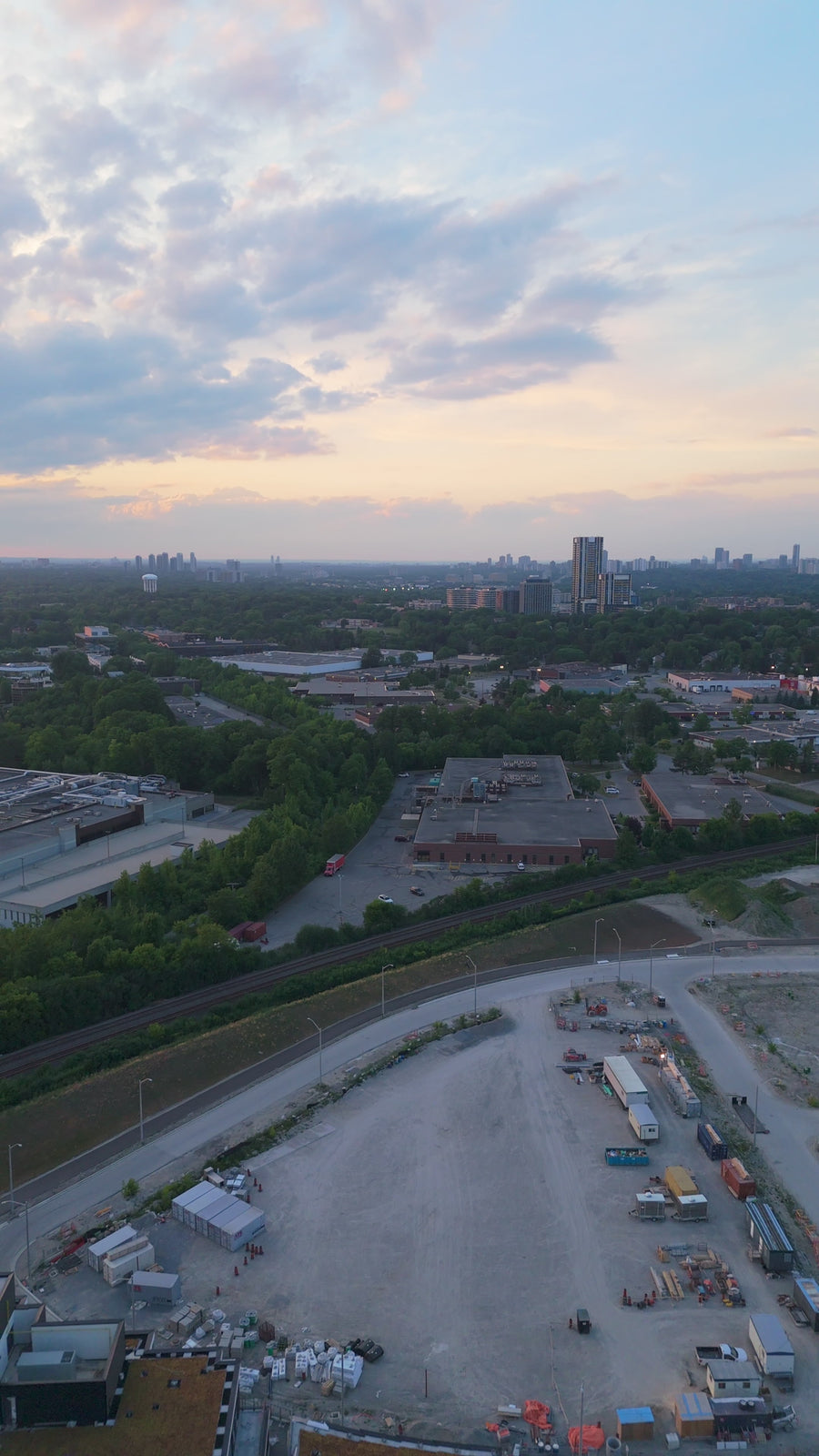 Urban Development Site at Sunset - Reveal Aerial