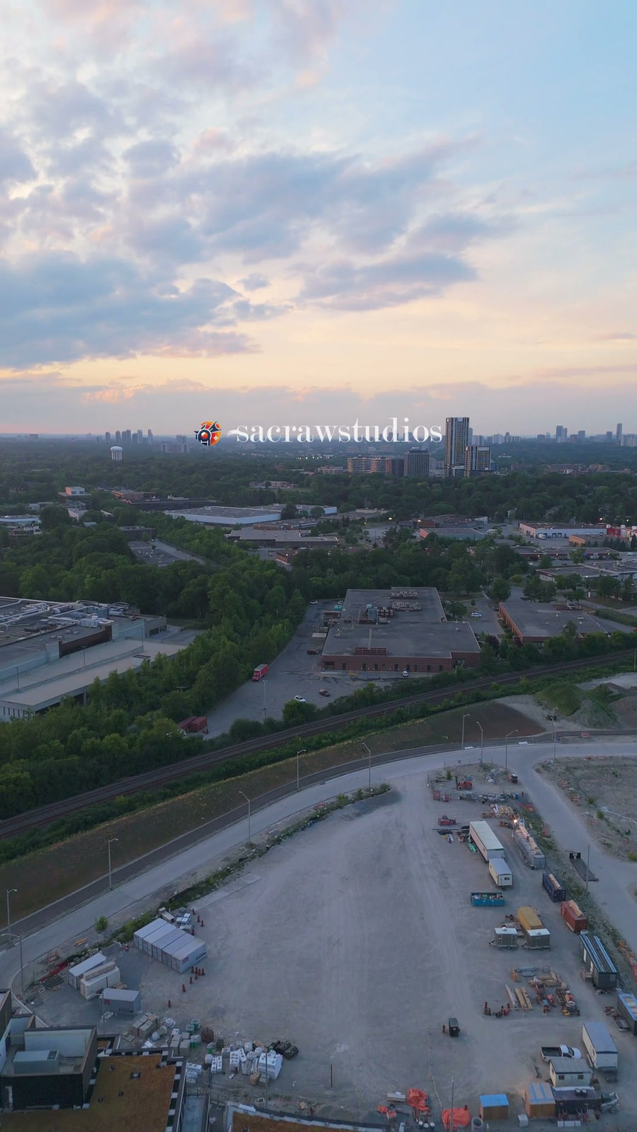 Urban Development Site at Sunset - Reveal Aerial
