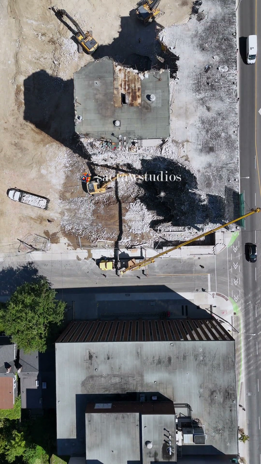 Building Demolition with Excavator - Overhead Aerial