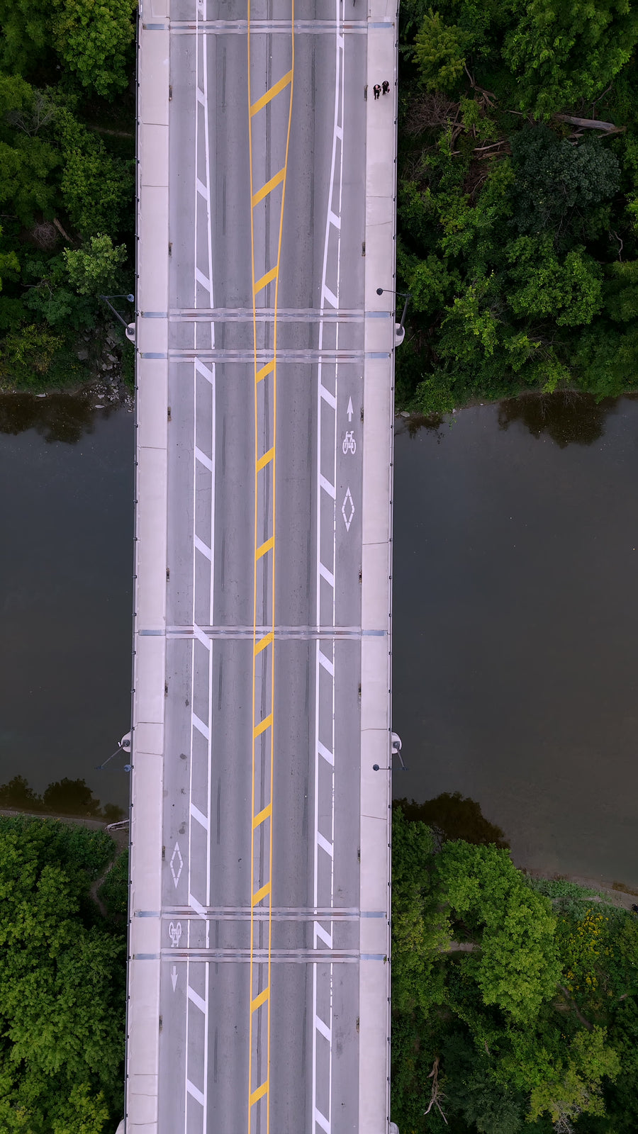 Asymmetric Bridge over Calm River - Aerial Tracking