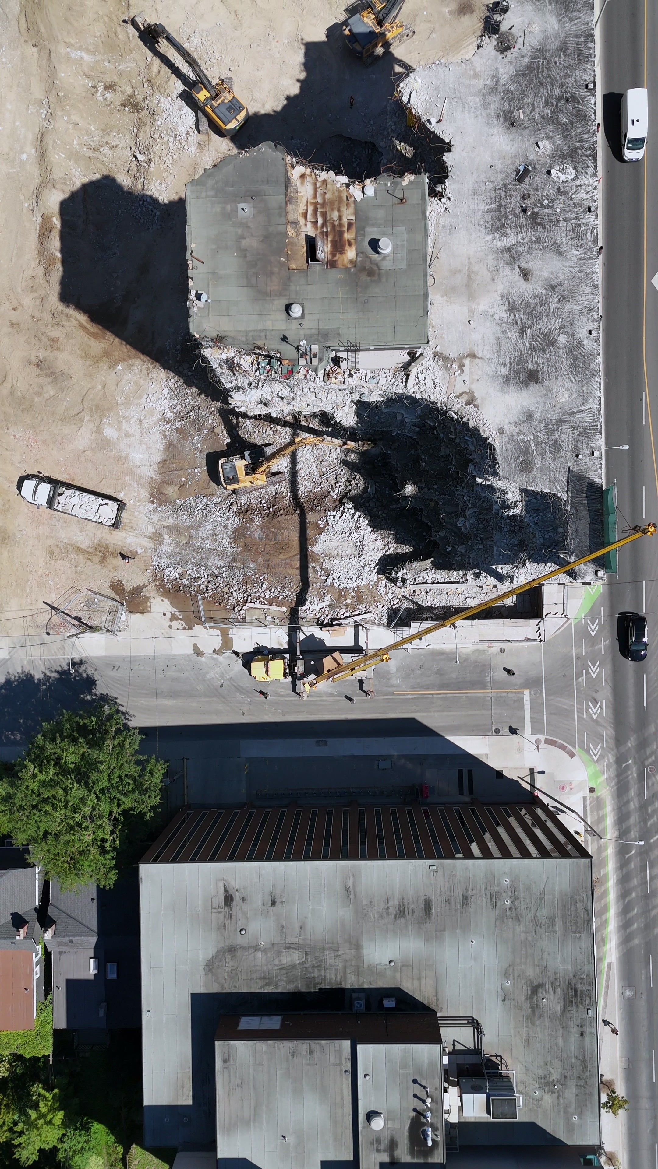 Building Demolition with Excavator - Overhead Aerial — 4K stock footage