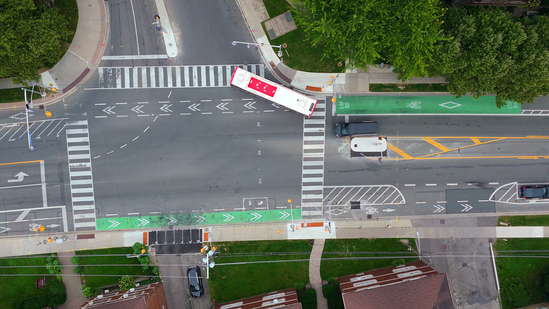 Busy City Intersection with Buses - Dynamic Zoom — 4K stock footage