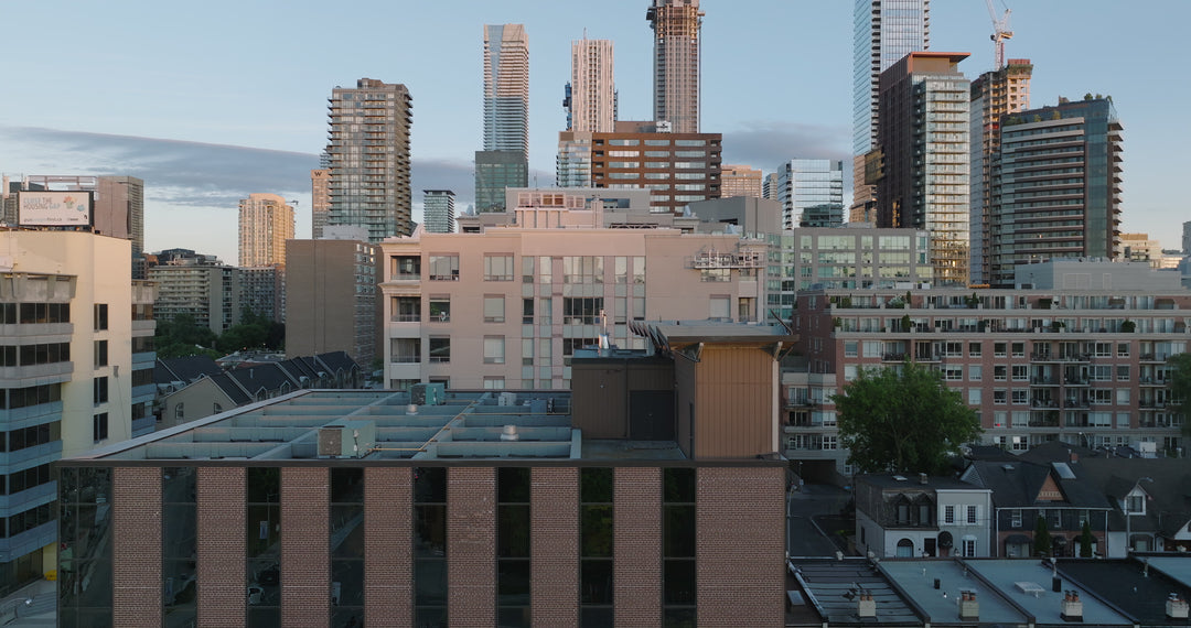 City Skyline Mixed Architecture at Golden Hour - Aerial — 4K stock footage