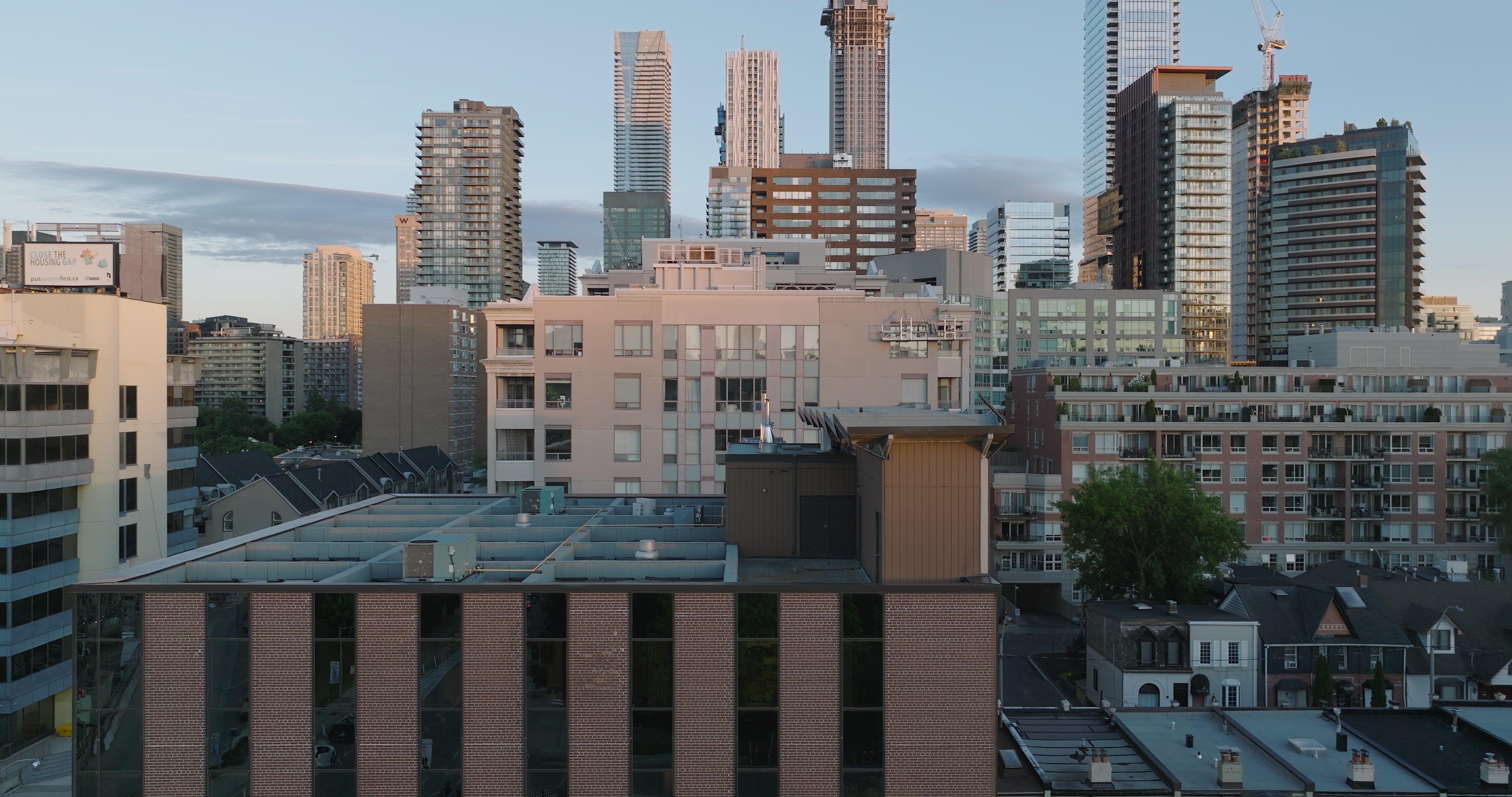 City Skyline Mixed Architecture at Golden Hour - Aerial — 4K stock footage