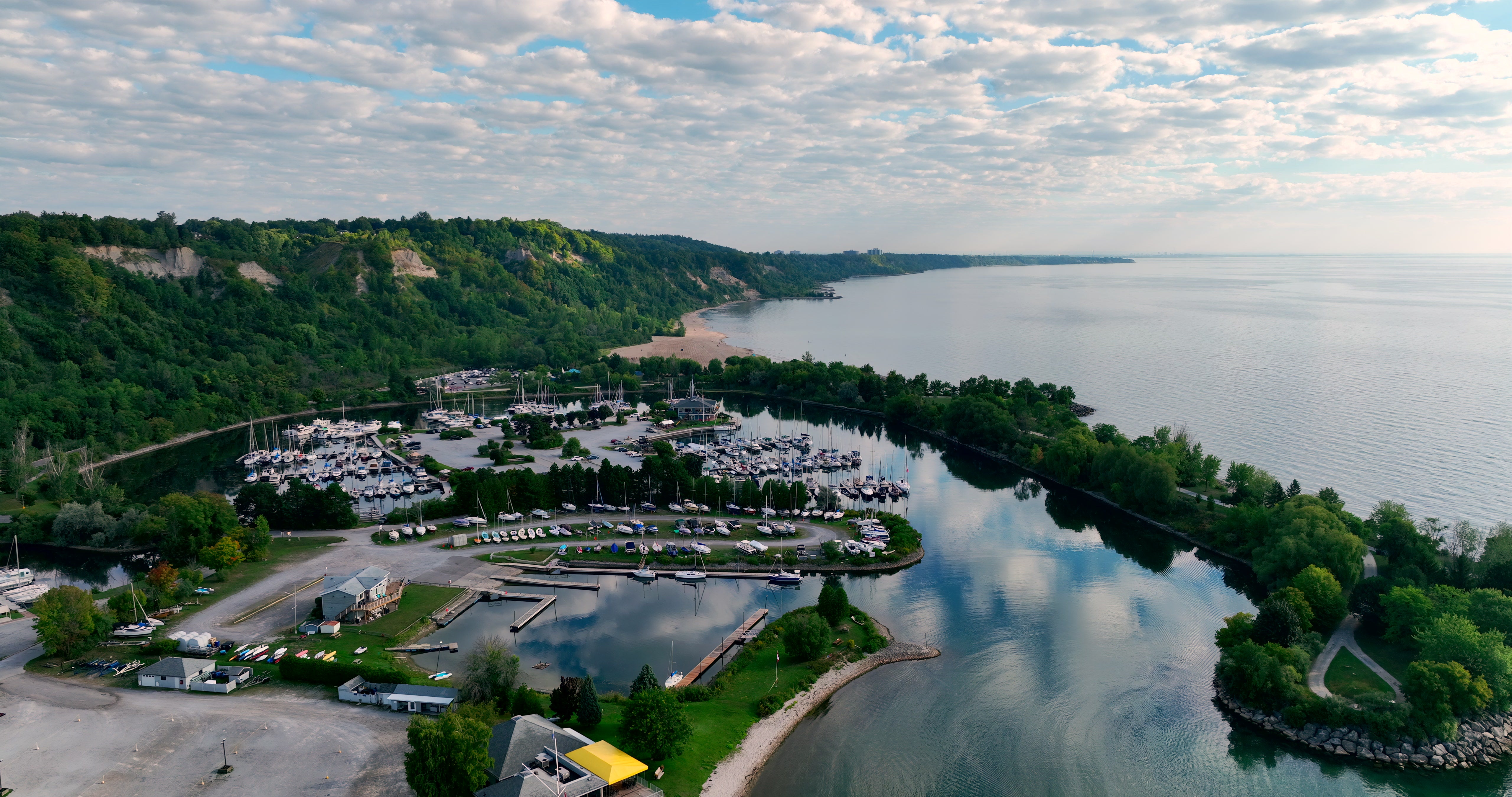 Coastal Marina with Docked Boats - Aerial — 4K stock footage