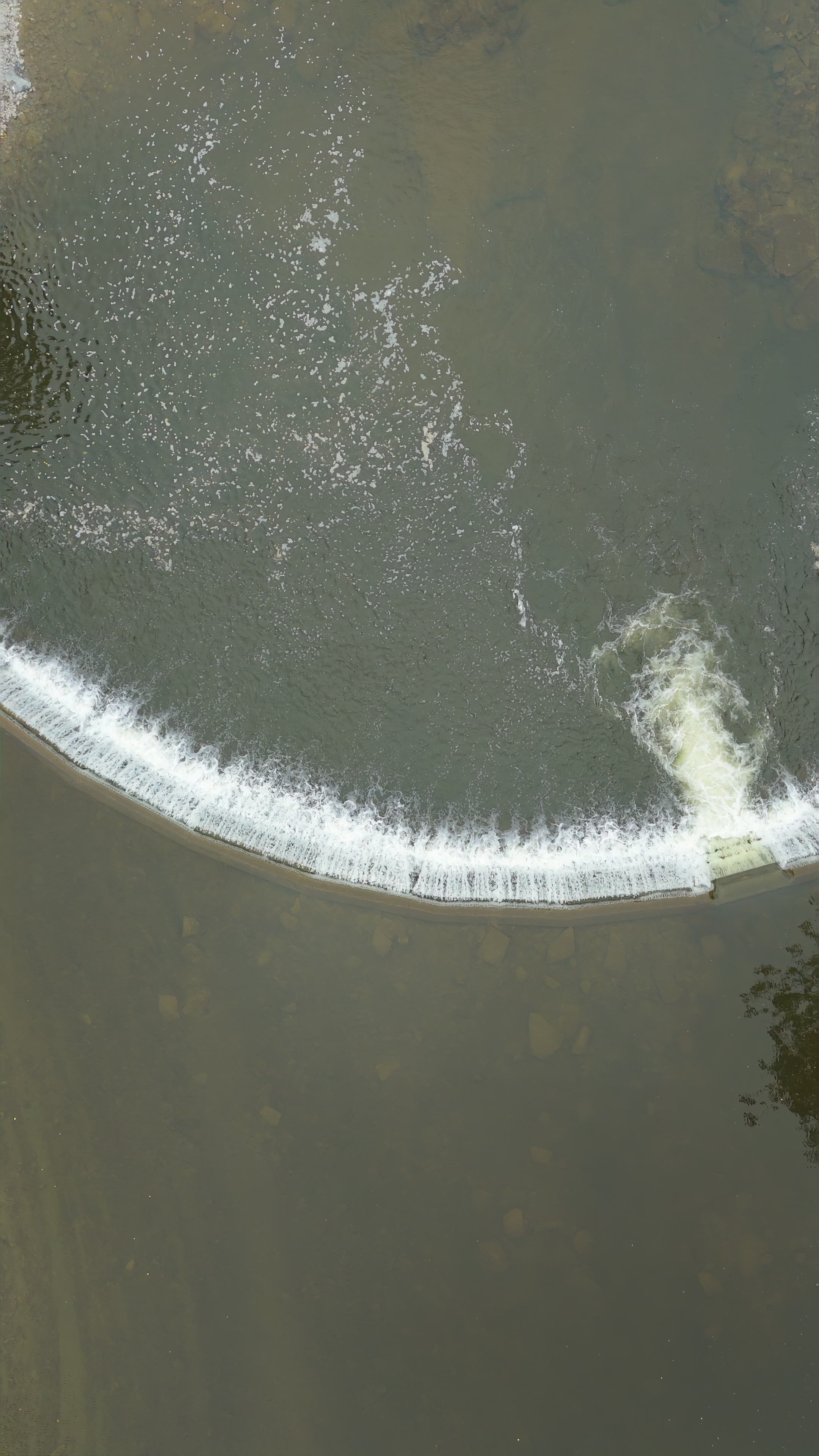 Curved River Weir with Flowing Water - Pullup Aerial — 4K stock footage