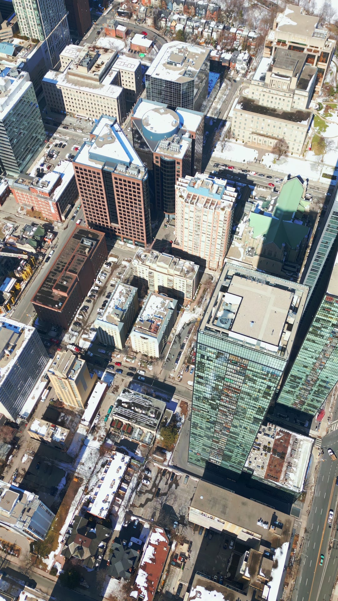 Aerial View of Snow-Covered Downtown City Skyscrapers in Winter — Premium 8K stock footage