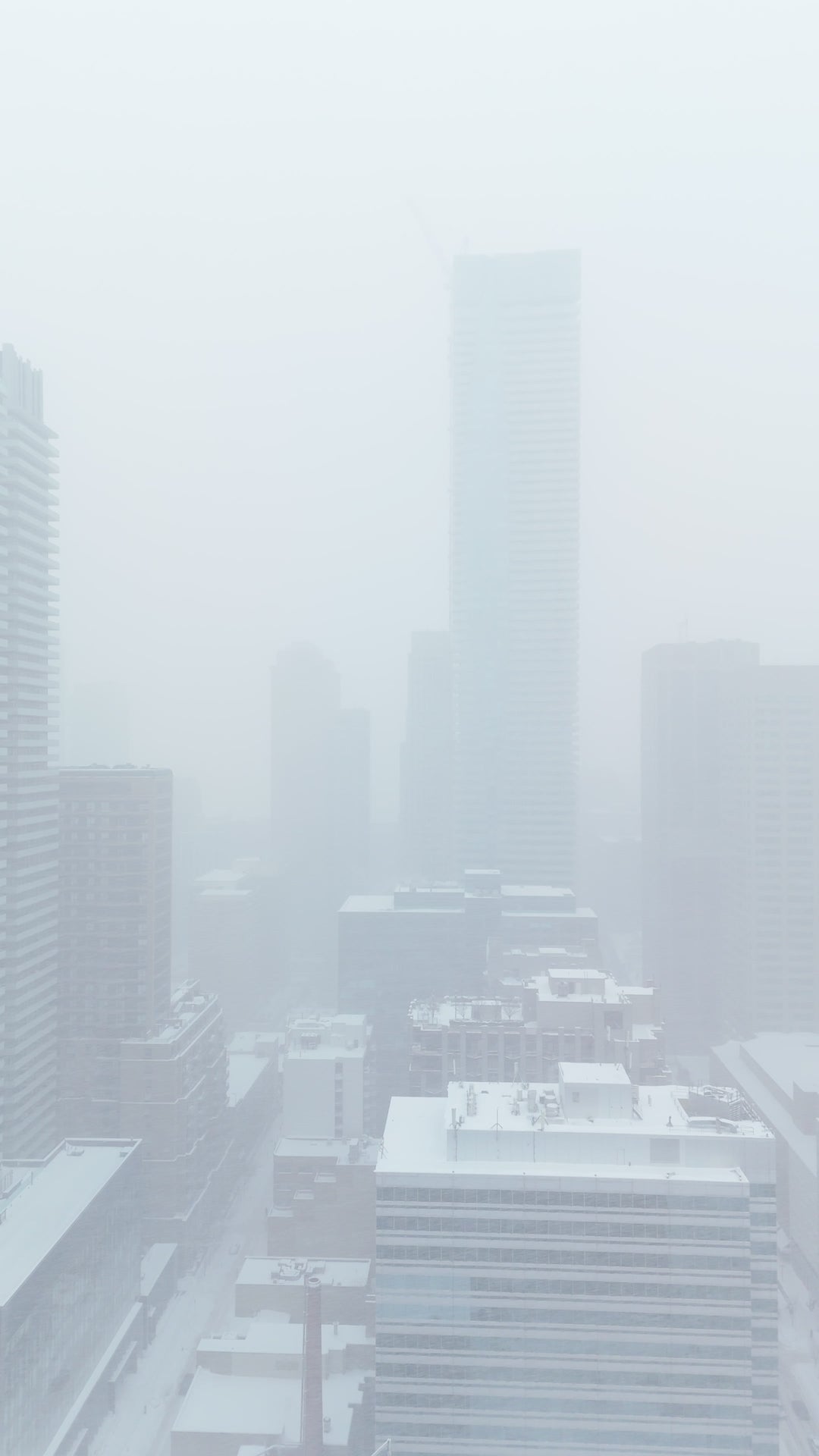 Foggy City Skyline in Winter Snow - Aerial Flythrough — 4K stock footage