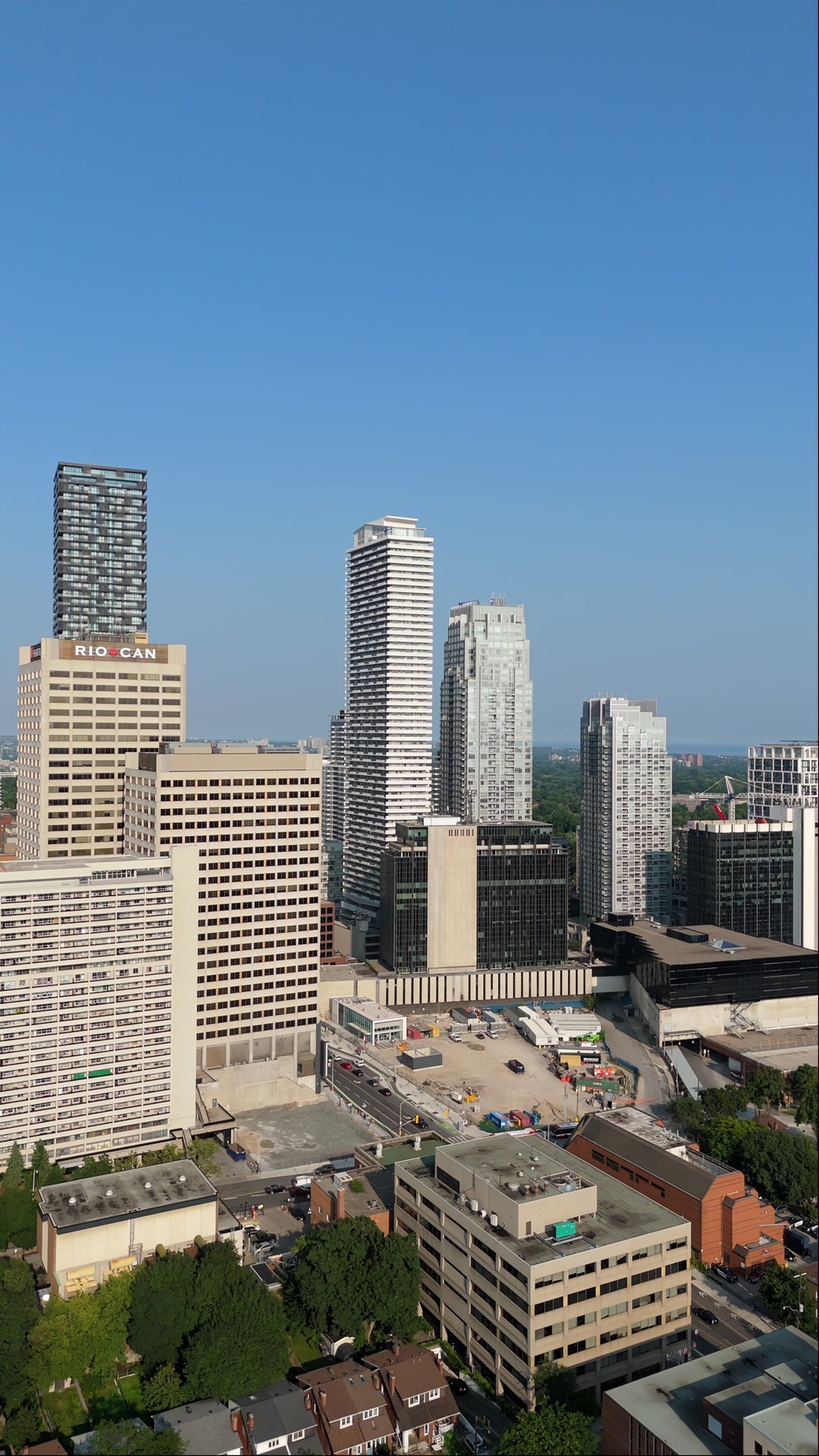 Aerial View of Modern Downtown City Skyline with Construction Site — Premium 8K stock footage
