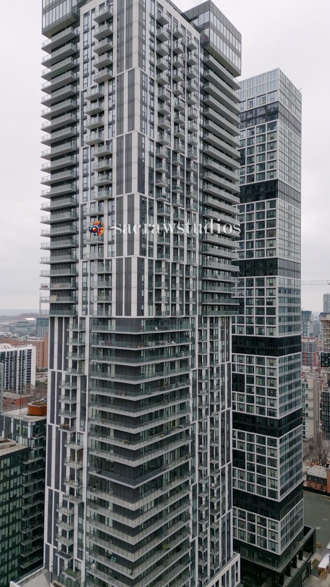 Modern Residential Skyscraper Overcast Day - Aerial Rising — 4K stock footage
