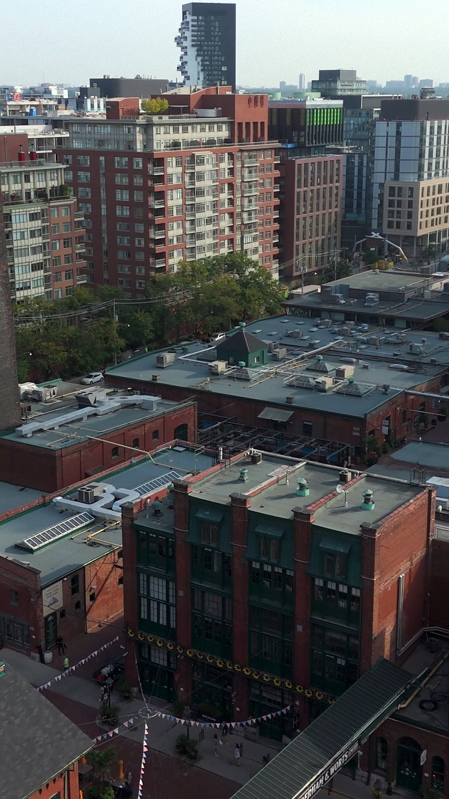 Red Brick Warehouses with City Skyline - Aerial