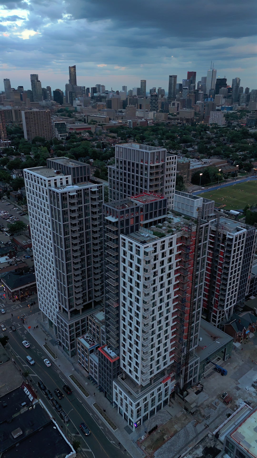 Residential Towers Dusk City Skyline - Aerial Pan — 4K stock footage