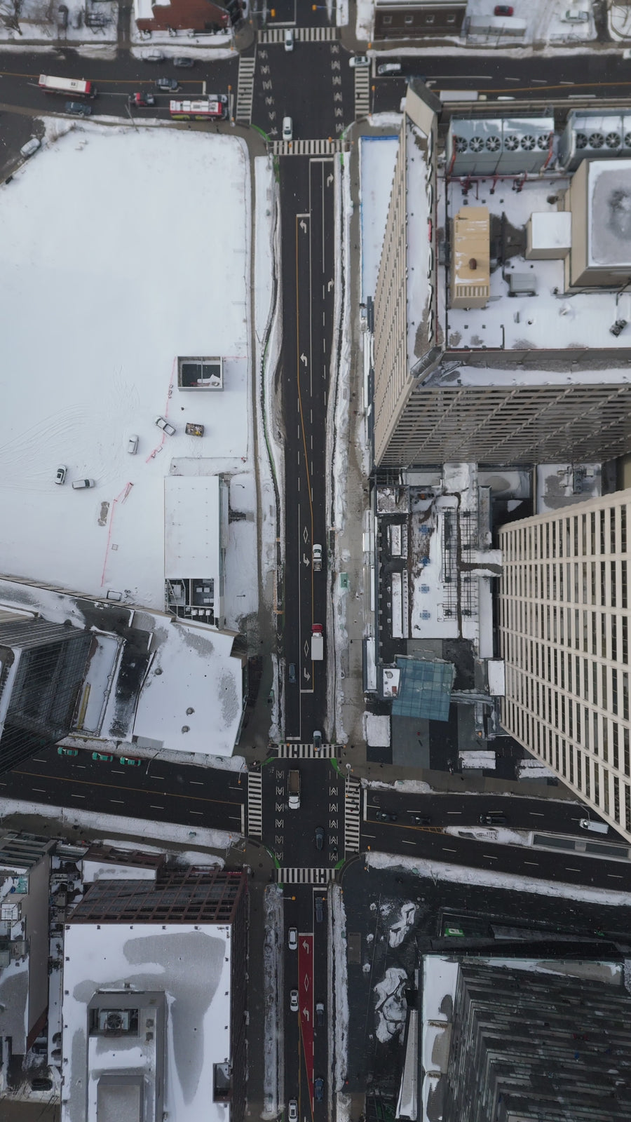 Snow-Covered City Intersection with Traffic - Top Down