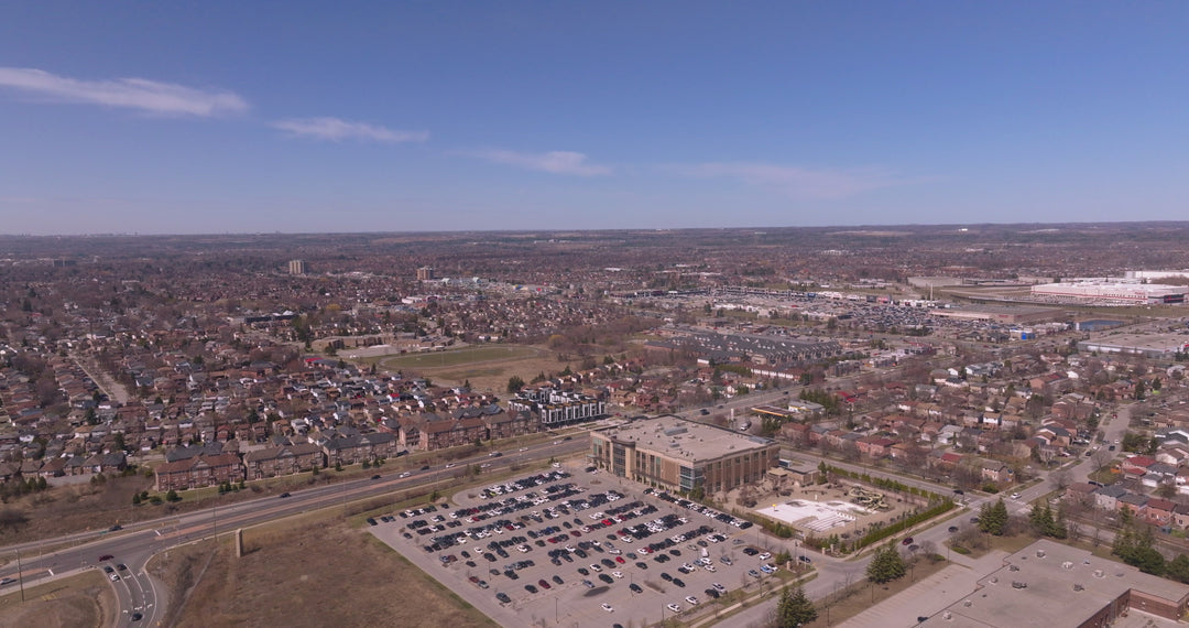 Suburban Cityscape with Commercial Building and Highway - Aerial