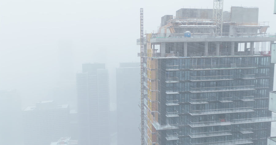 Skyscraper Construction Site in Winter Fog - Aerial Drone