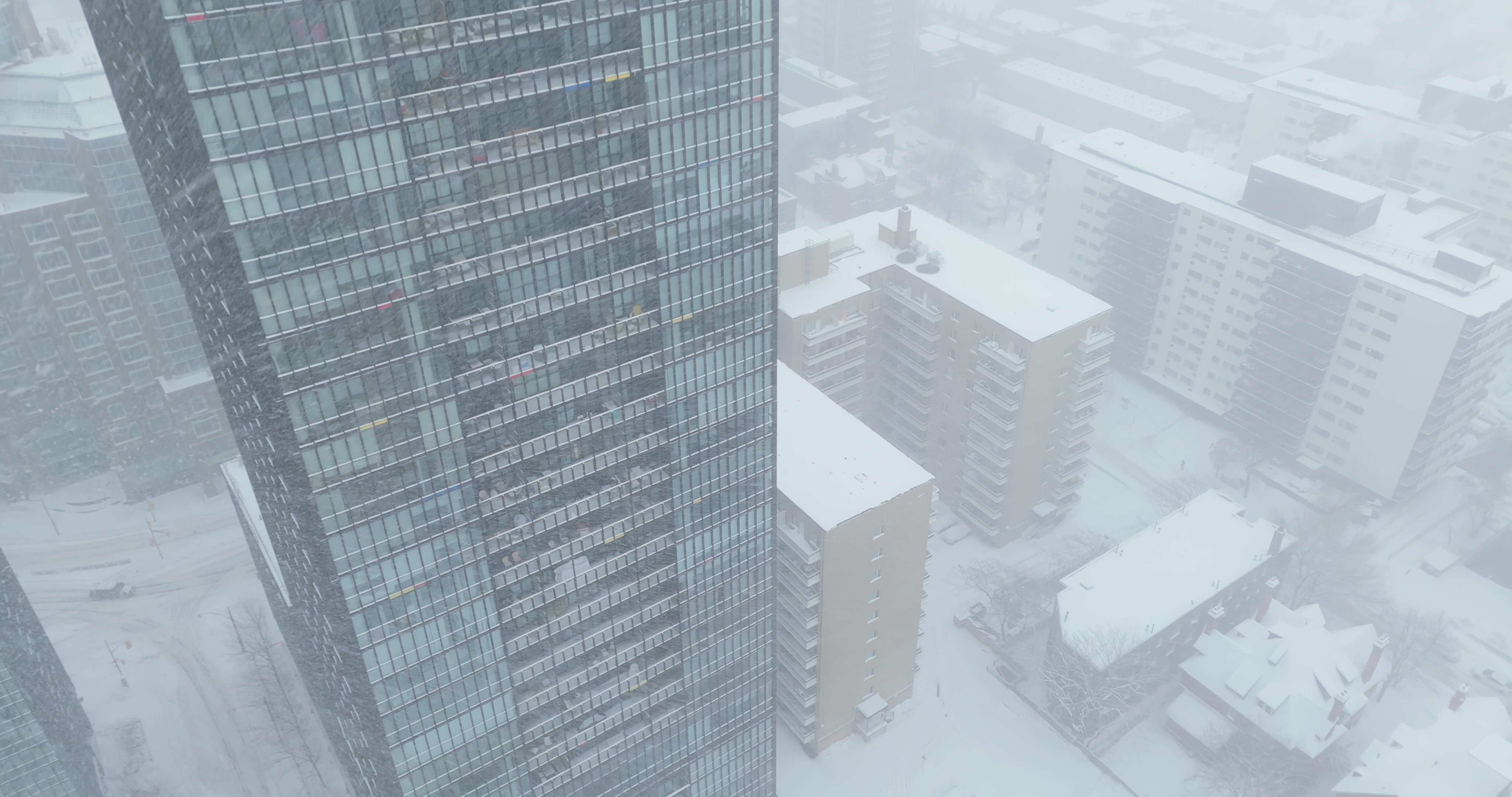 Snowy Downtown Cityscape in Blizzard - Aerial in Toronto in winter — 4K stock footage