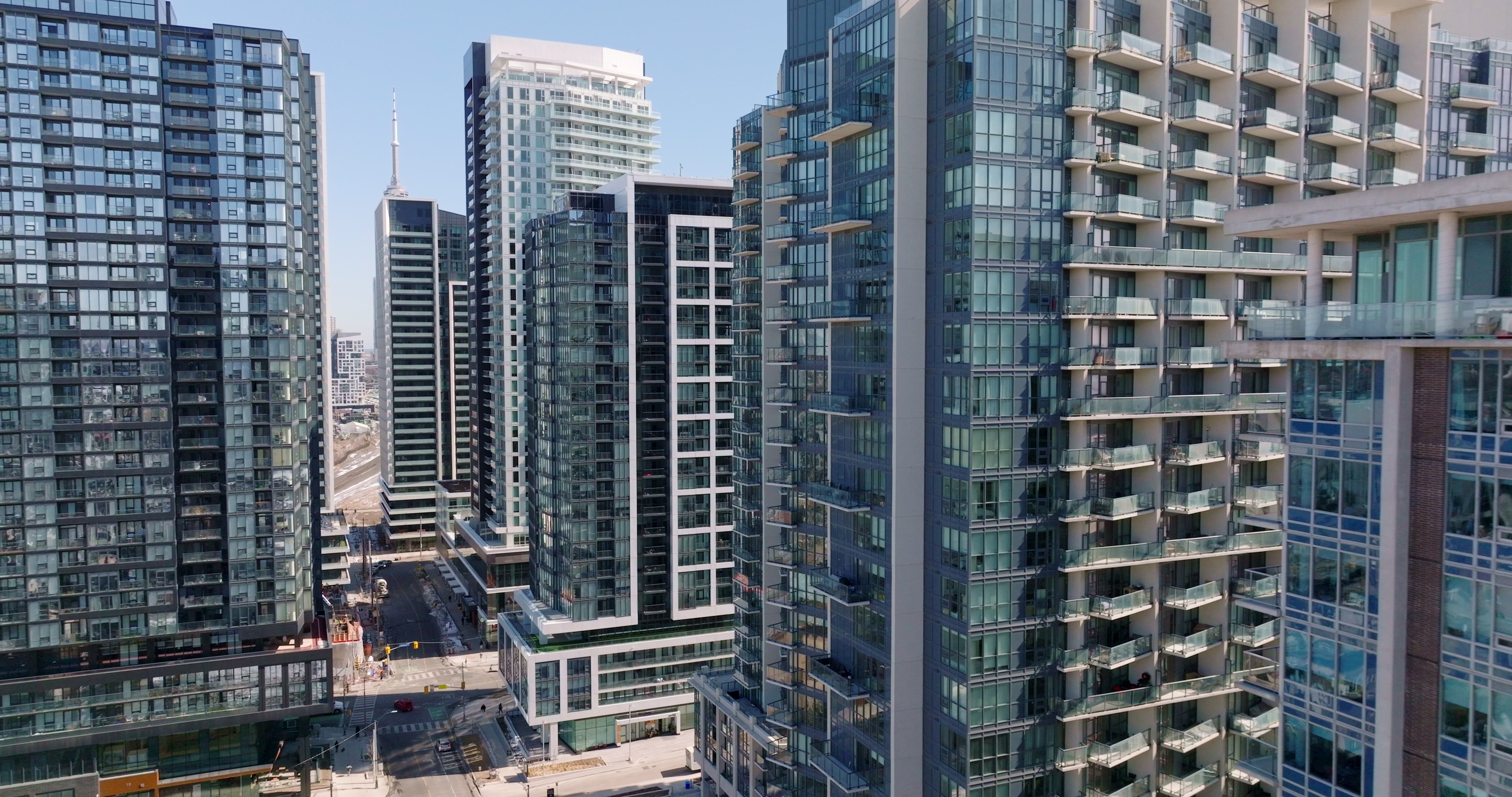 Toronto Downtown Condo Towers with Toronto Tower - Pullback Aerial — 4K stock footage