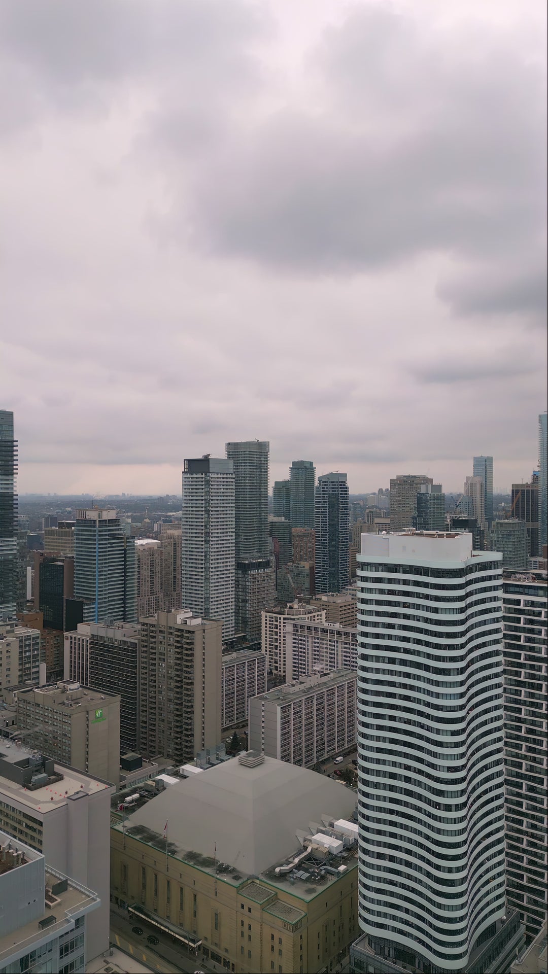 Aerial Drone Shot of Modern Downtown Skyline with Cloudy Sky — Premium 4K stock footage
