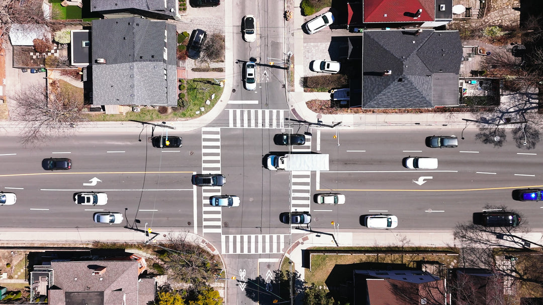 Aerial Top-Down View of Busy Urban Intersection with Traffic Flow — Premium 4K stock footage