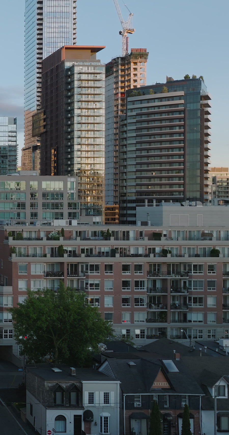 Urban Cityscape with Construction Crane at Golden Hour