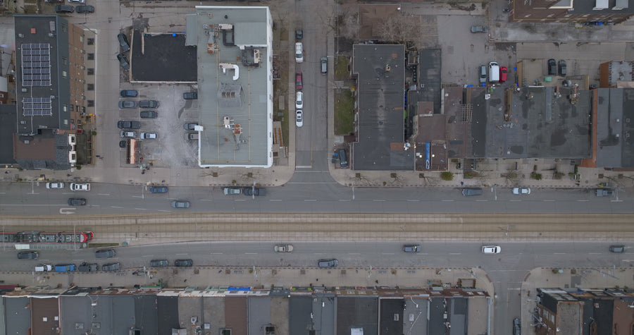 Winter City Street with Tram Tracks - 6K Aerial