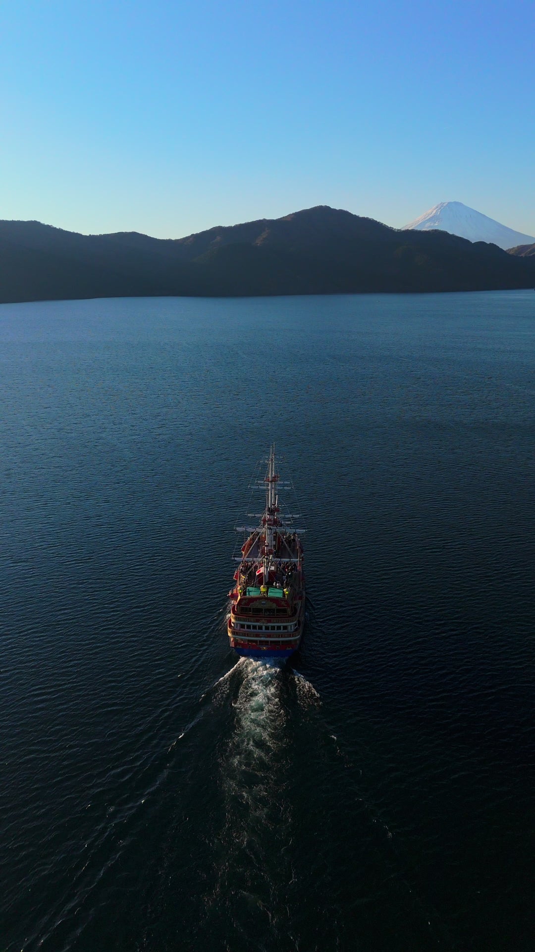 Aerial View of Pirate Ship Cruising Toward Mount Fuji — Premium 4K stock footage