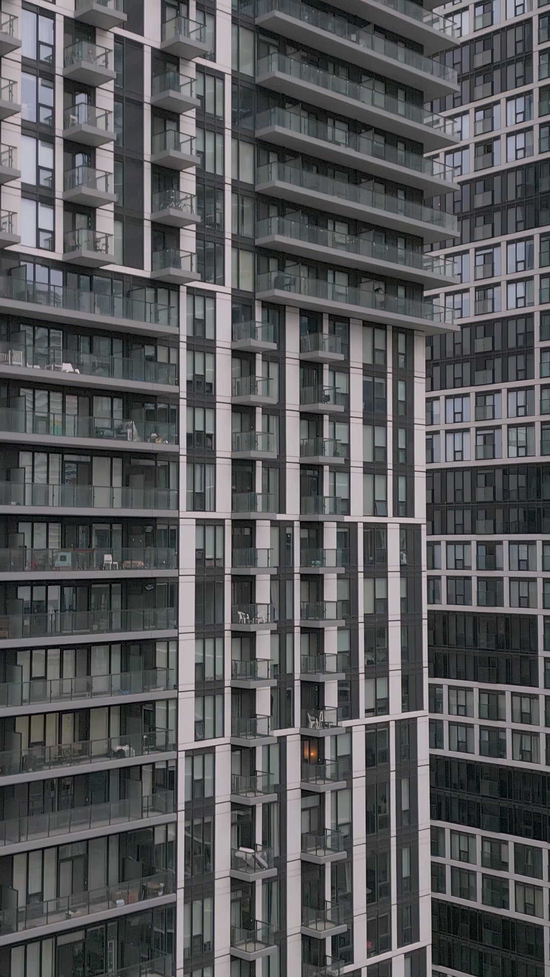 Modern High Rise Apartment Building Facade with Glass Balconies in Toronto — 4K stock footage
