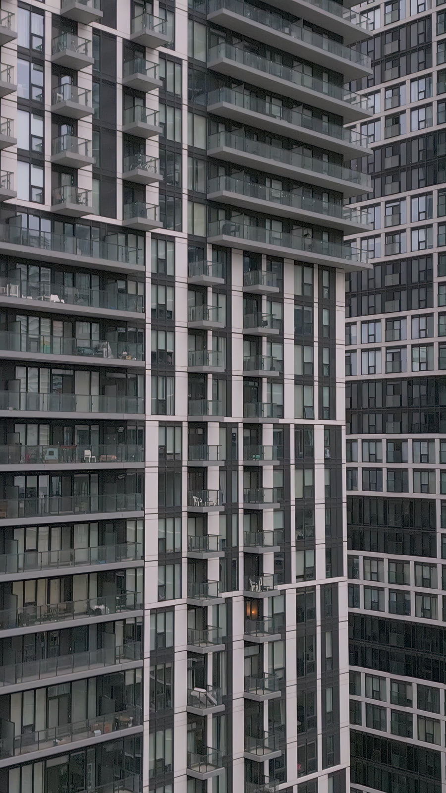 Modern High Rise Apartment Building Facade with Glass Balconies