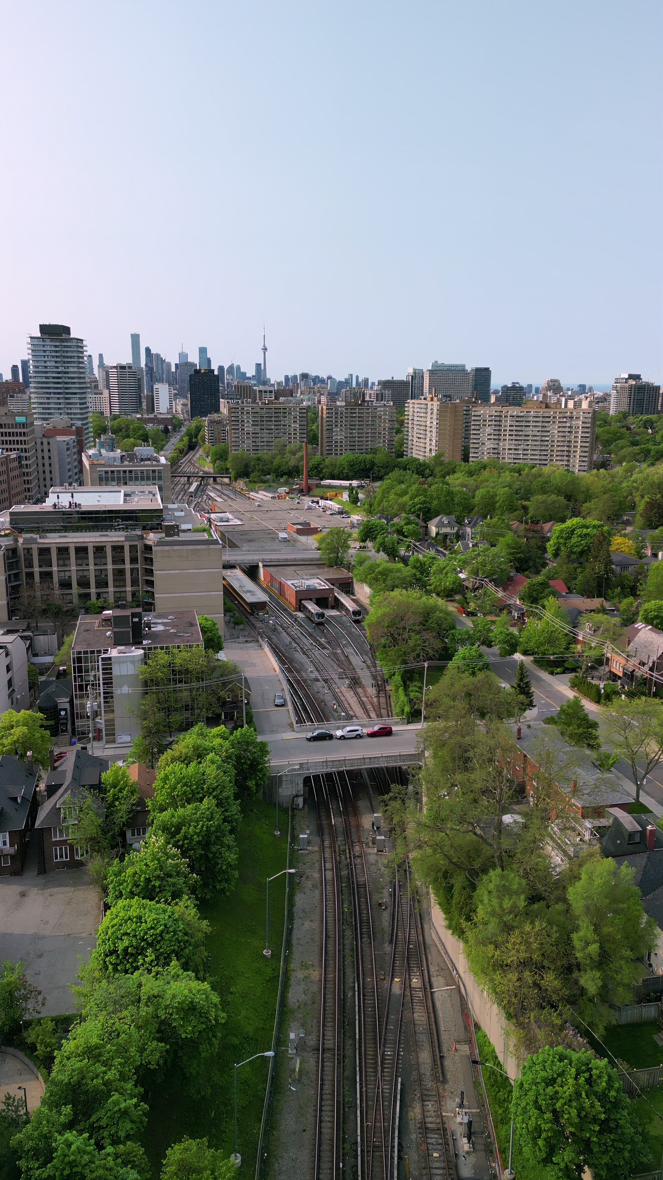 Toronto Skyline and Railway Tracks - Vertical Aerial in summer — 4K stock footage