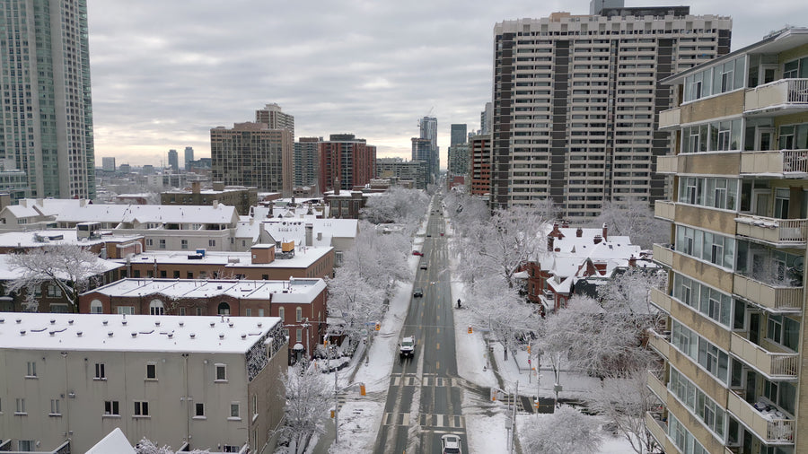 Snow-Covered City Street with Traffic - 5K Aerial