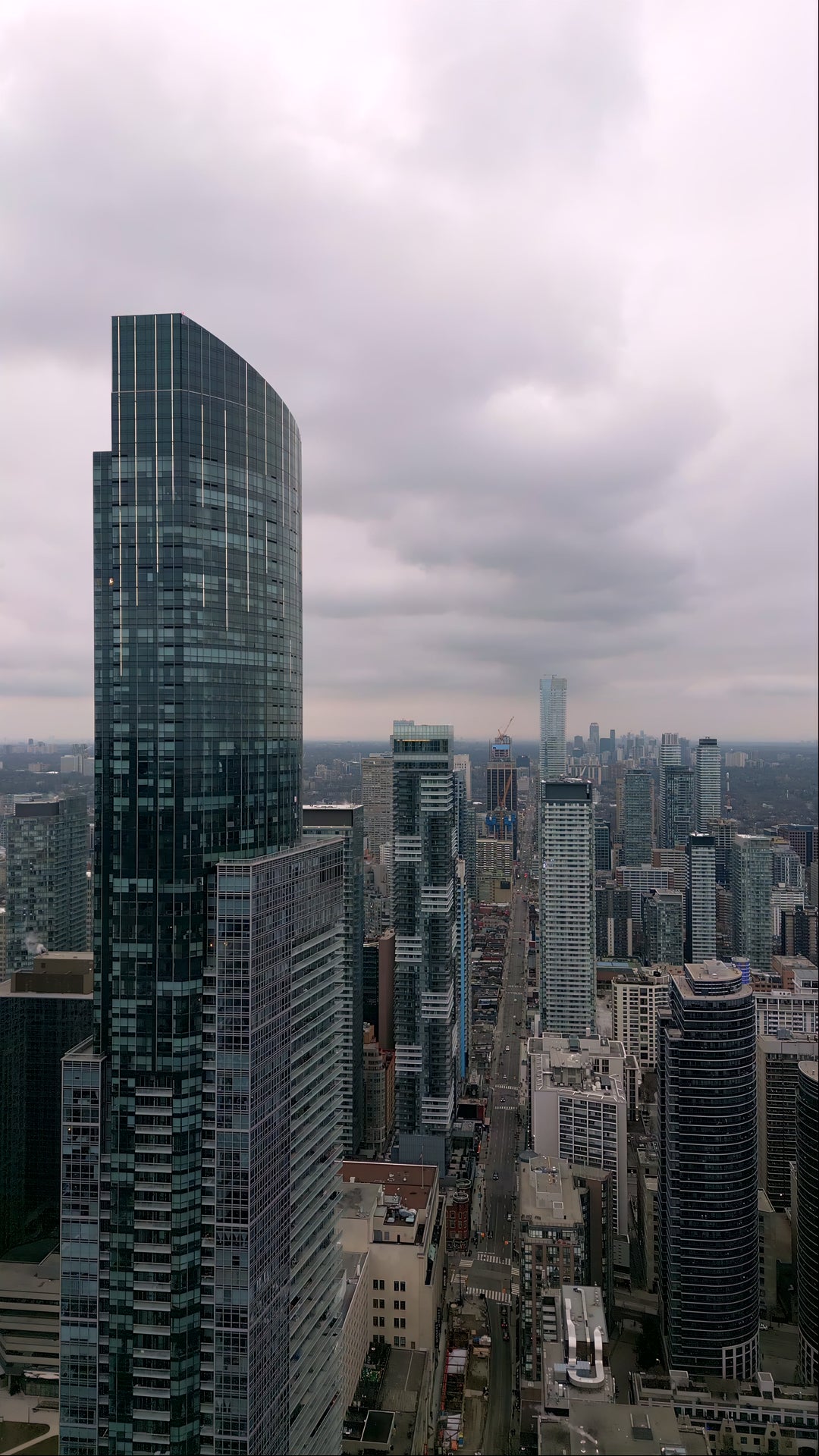 Aerial Drone View of Modern Downtown Skyscrapers on Overcast Day — Premium 4K stock footage