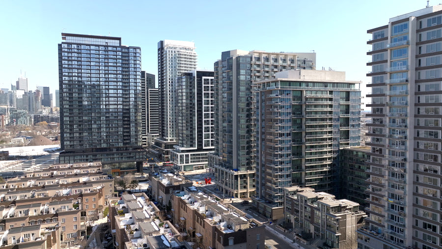 Toronto Condo Towers with CN Tower and Lake Ontario - 4K Aerial
