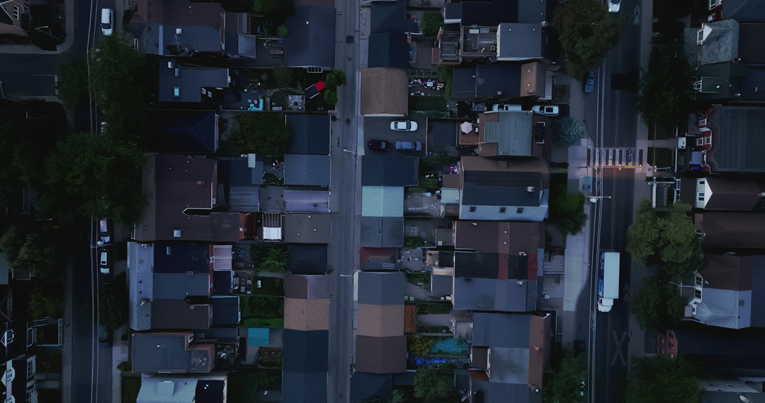 Suburban Street at Dusk with Traffic - Top Down Aerial — 4K stock footage