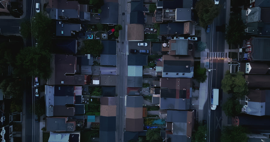 Suburban Street at Dusk with Traffic - Top Down Aerial