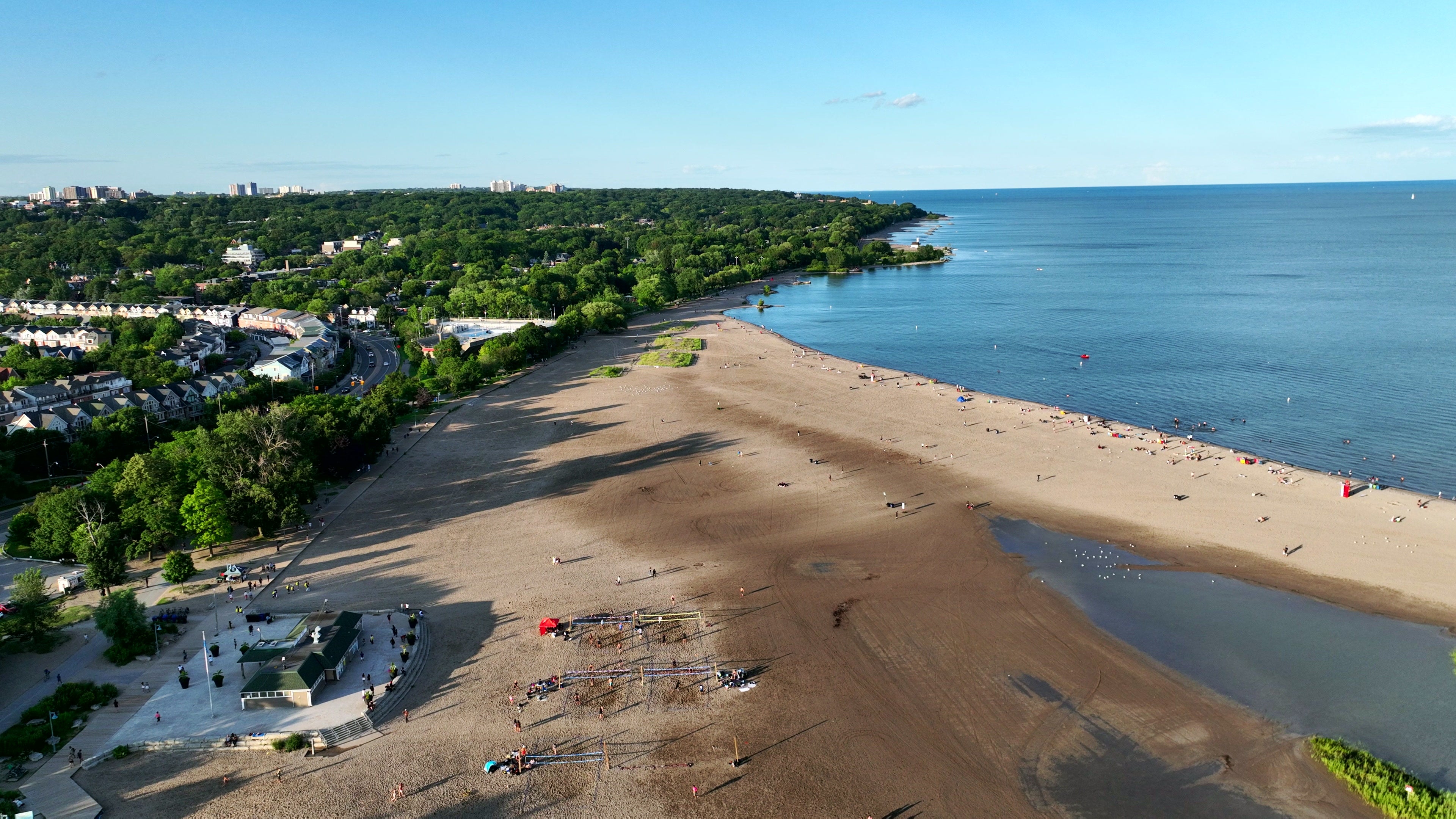 Sandy Beach with Calm Blue Ocean - Aerial in Canada in summer — 4K stock footage