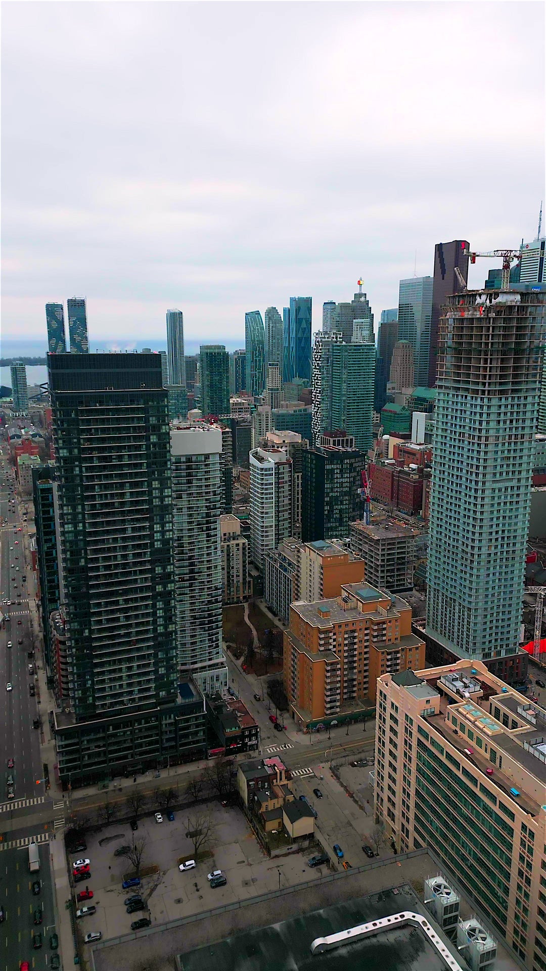 Aerial View of Modern Downtown City Skyline with Construction Crane — Premium 4K stock footage