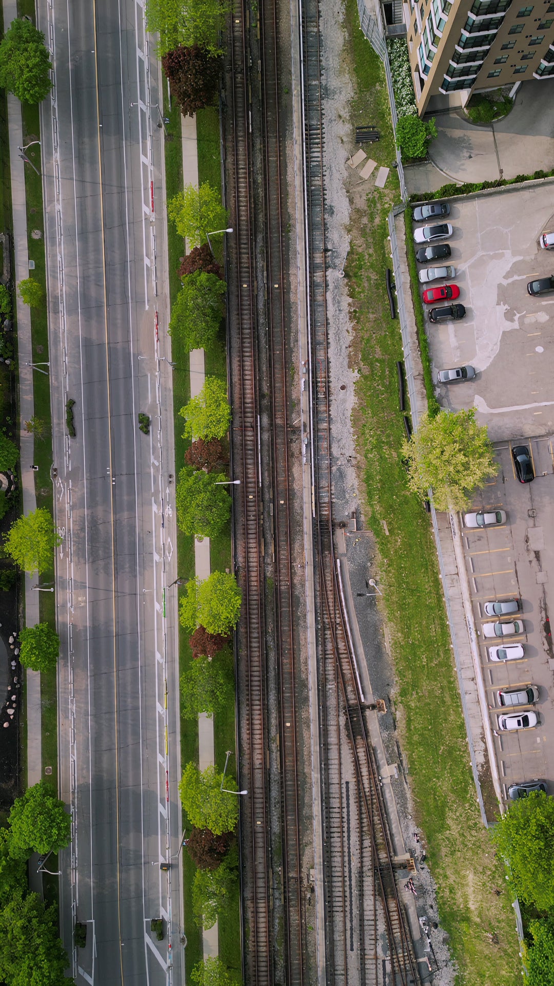 Aerial Top Down View of City Highway and Railway Tracks — Premium 4K stock footage
