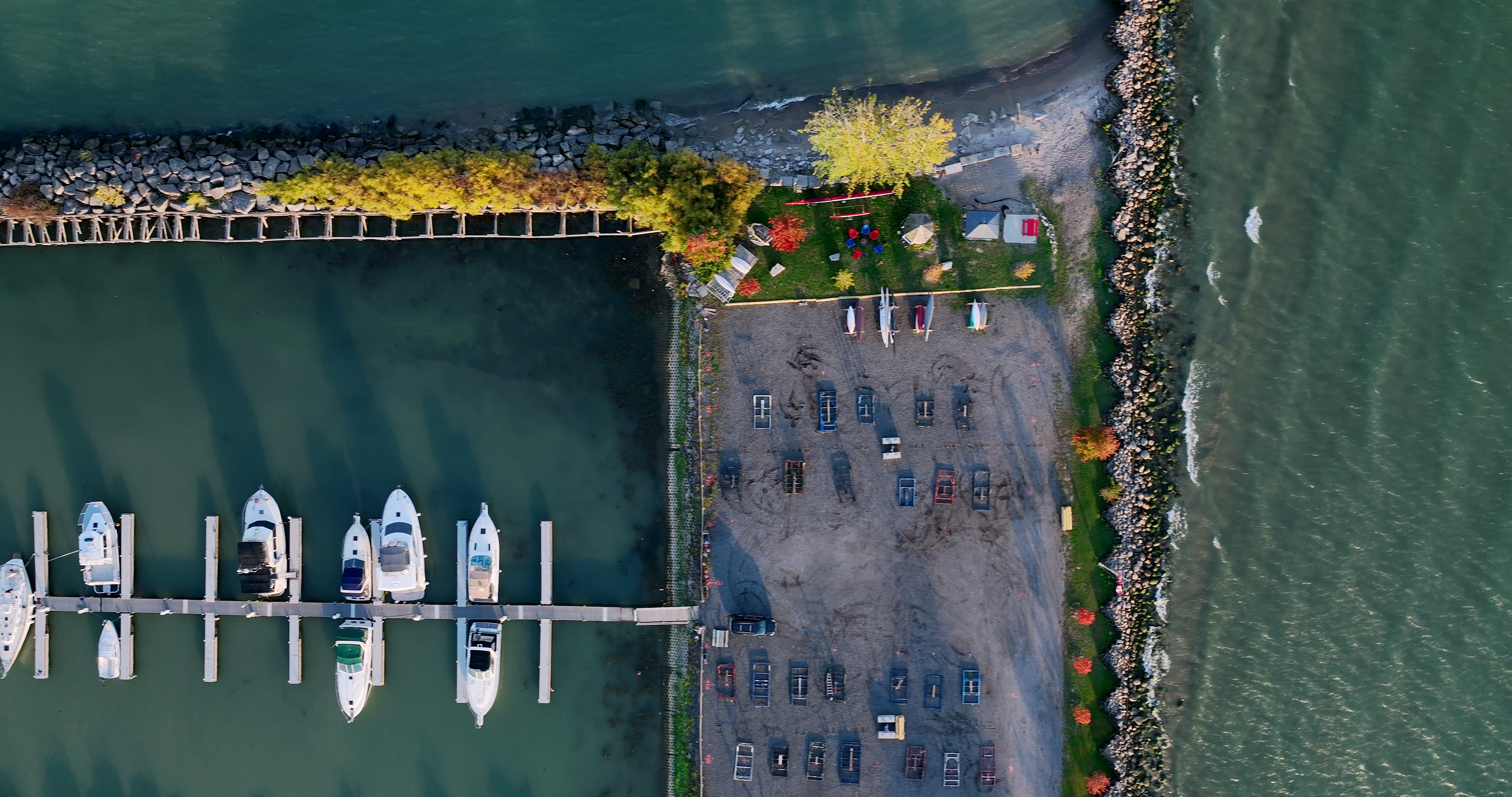 Marina with Docked Boats and Breakwater - Top Down in autumn — 4K stock footage
