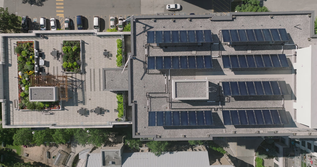 Modern Building with Solar Panels and Green Roof - Top Down — 4K stock footage