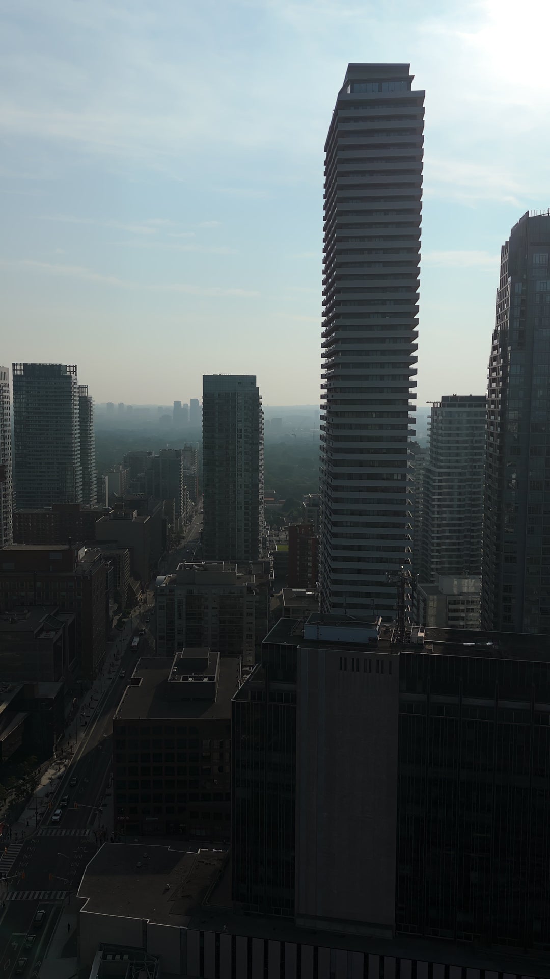Modern Skyscraper in Urban Cityscape at Sunrise - Aerial in Toronto — 4K stock footage
