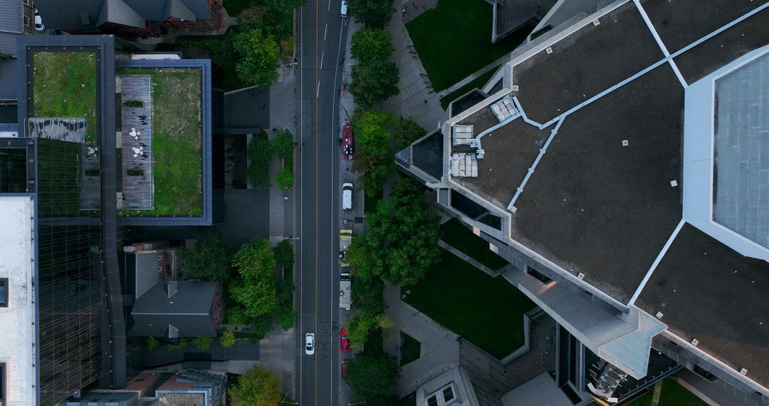 Aerial Top Down View of Modern Geometric Rooftop Architecture and City Street — Premium 4K stock footage