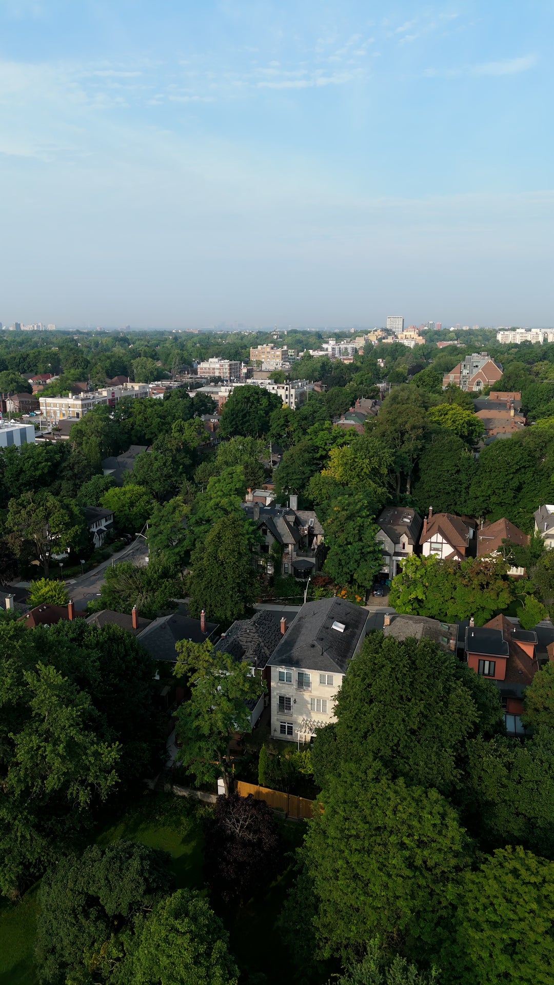 Lush Green Residential Neighborhood with City Skyline - Aerial in Toronto in summer — 4K stock footage