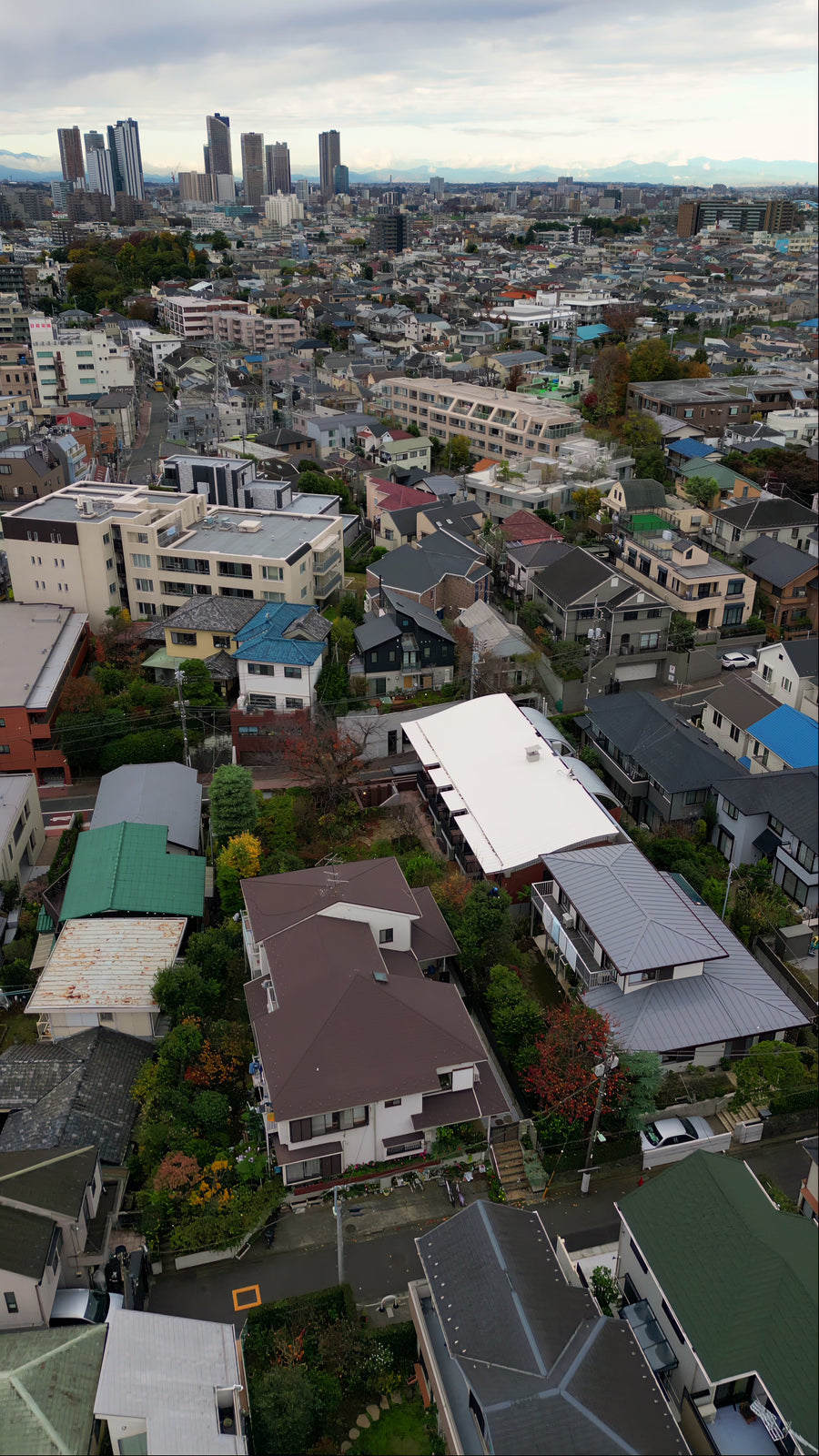 Japanese Suburban Neighborhood and City Skyline - 5K Aerial