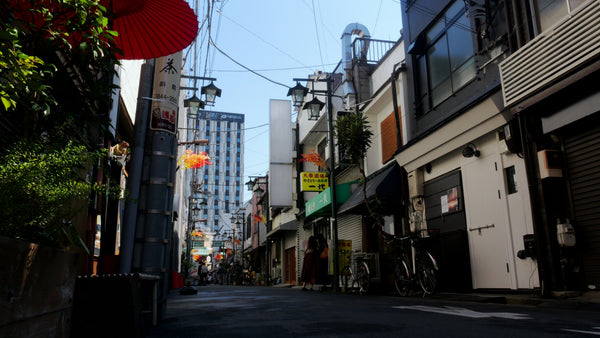 Traditional Japanese Alley with Modern Skyscraper in Background