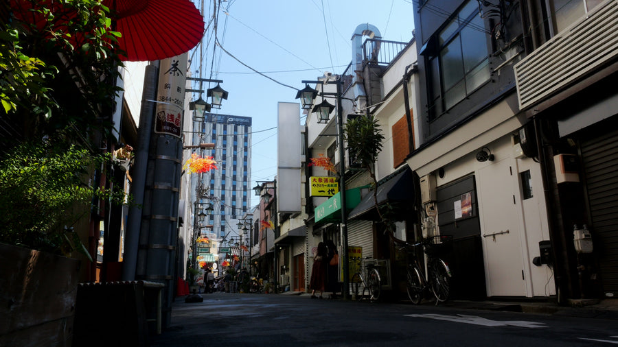 Traditional Japanese Alley with Modern Skyscraper in Background