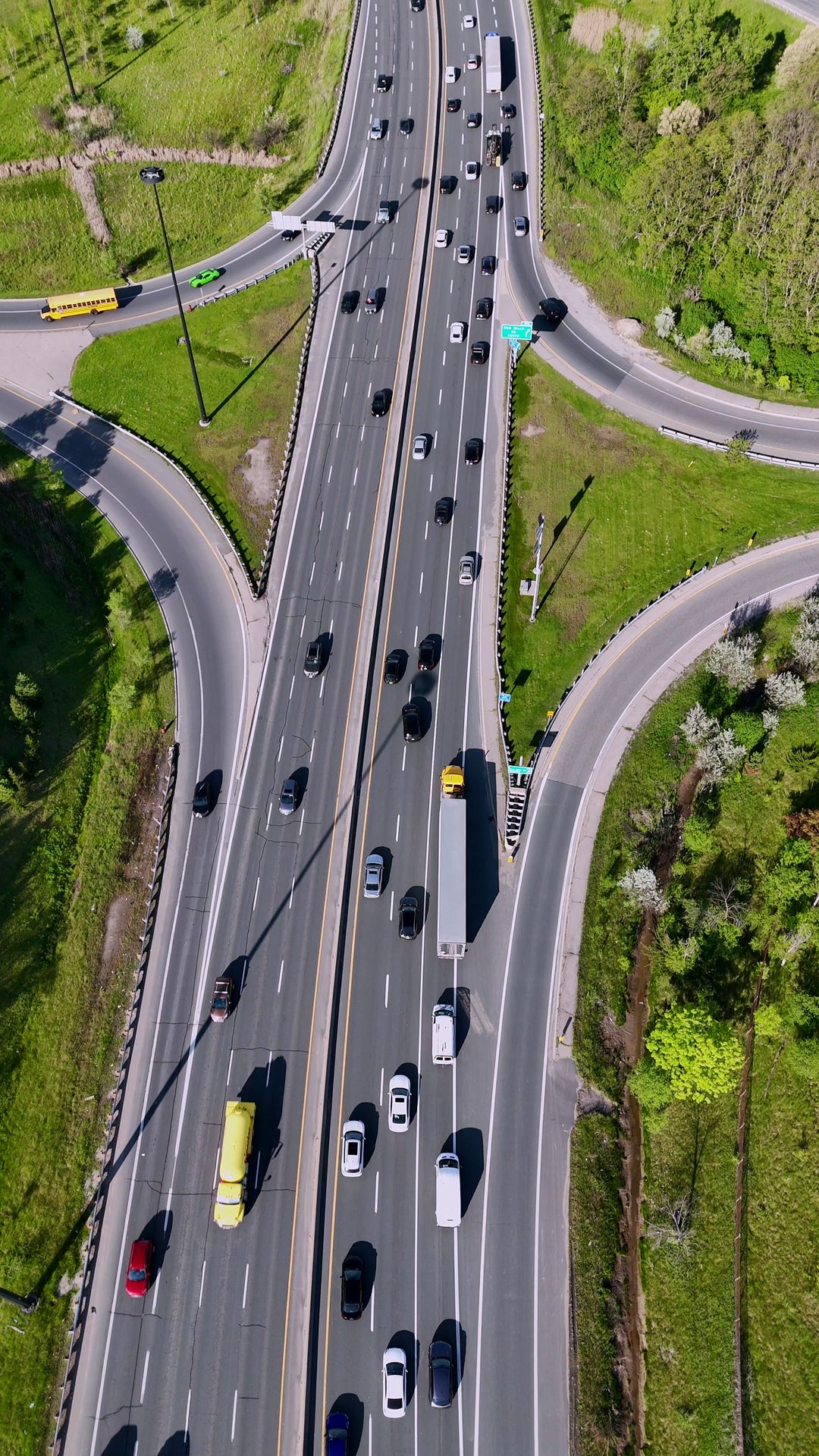 Highway Interchange with City Skyline - Vertical Aerial in Toronto — 4K stock footage
