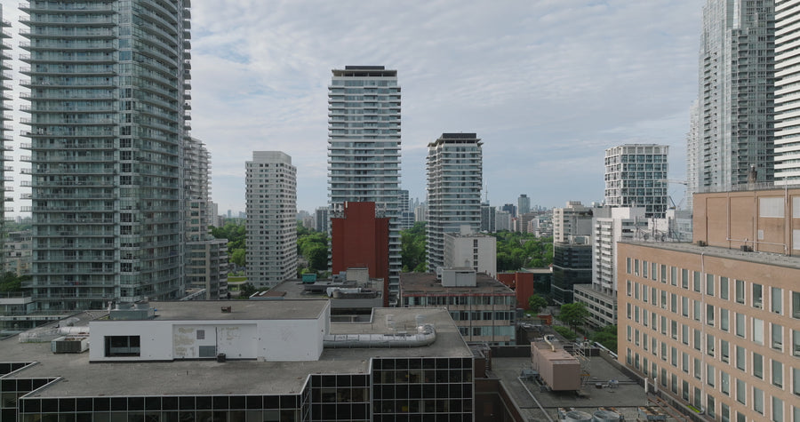 Urban Cityscape with High-Rise Towers - 4K Aerial