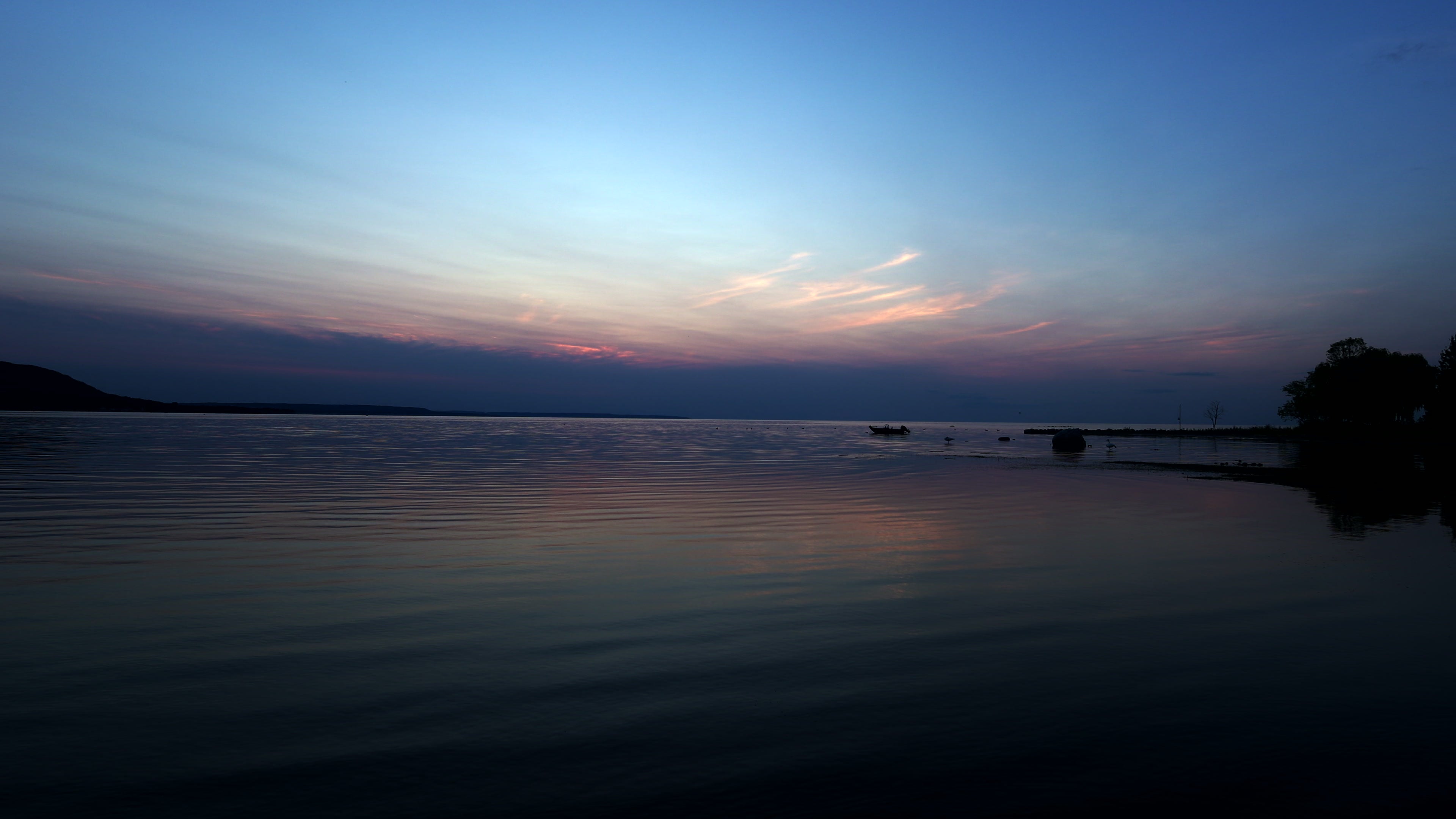Serene Lake at Twilight with Colorful Sky Reflection at sunset — 4K stock footage